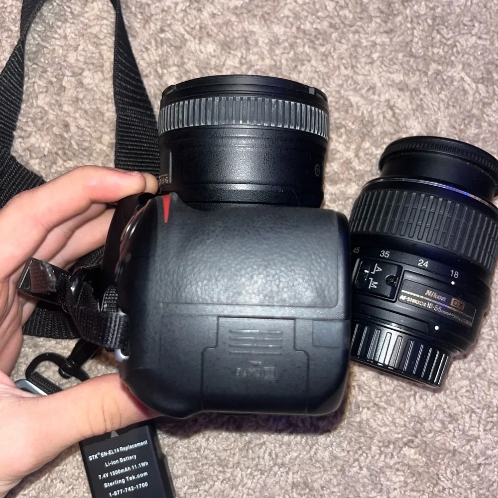 Nikon D3200 Camera. Includes Battery, 3 Nikon Lenses, Battery Charger, and Case.